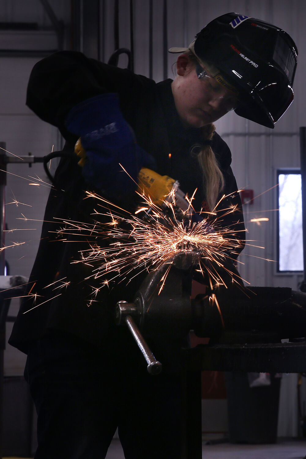 Kennedy Rhoads smooths and cleans up the welded edges